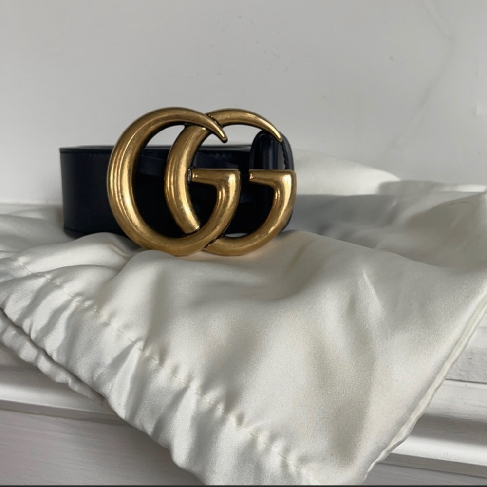 Black and gold Gucci belt